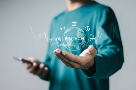 Fintech (financial technology), digital banking concept. Businessman using smartphone with digital finance icons. Internet payment, online shopping, financial technology.