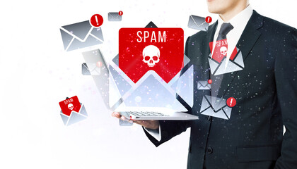 Businessman holding laptop with spam email alerts, white background