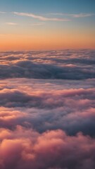 Obraz premium Low clouds lingering near the horizon at dawn, with the sky glowing in pastel shades of yellow, pink, and blue, creating a calming atmosphere 
