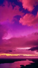 Fototapeta premium Low clouds lingering near the horizon at dawn, with the sky glowing in pastel shades of yellow, pink, and blue, creating a calming atmosphere 