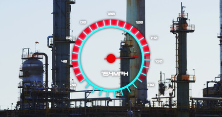Image of speedometer over refinery