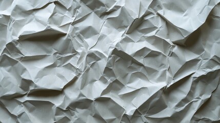 Obraz premium A Close-Up View of a Crumpled Sheet of White Paper