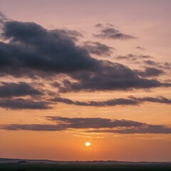 A tranquil dawn sky with wisps of clouds floating close to the ground, bathed in soft morning light as the day begins
