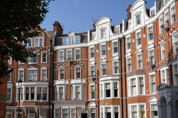 Elegant colorful old brick townhouses and apartment buildings in Chelsea district of London