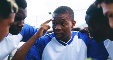 Group, athlete and huddle for sports on soccer field with game plan, teamwork and practice challenge. People, thinking and prepare of football competition, fitness performance and tournament training © AzeemudDeen/peopleimages.com