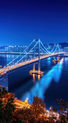 Naklejka premium Modern Suspension Bridge Illuminated at Night