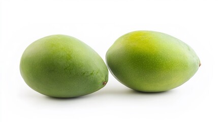 Obraz premium Two Green Mangoes on a White Background