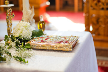 Detail of Greek Orthodox baptism, decorated table prepared for baptismal, Orthodox rituals