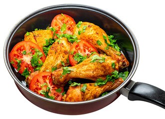 Delicious chicken thighs with tomatoes and greens in a hot pan