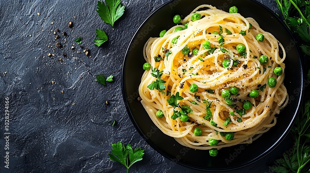 Poster pasta with green vegetables and creamy sauce in black bowl on grey stone background top view copy sp