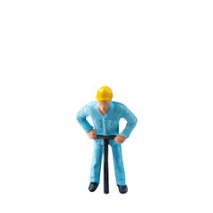 Miniature construction worker in a blue uniform isolate on white background with clipping path