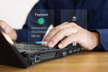 The man pointed to the shopping icon on the computer screen, and the shopping cart was full of various items.