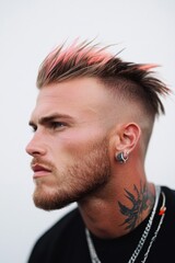 Obraz premium Man with pink hair and tattoos posing