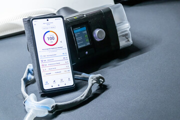 CPAP machine with nose CPAP mask and smartphone with digital app for treatment stats and medical reports or health reports and digital assistant for therapy analysis and therapy reports patient files
