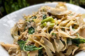 Pad Kaphrao is Stirred and fried banana blossom with holy basil and chilies served on steamed rice.