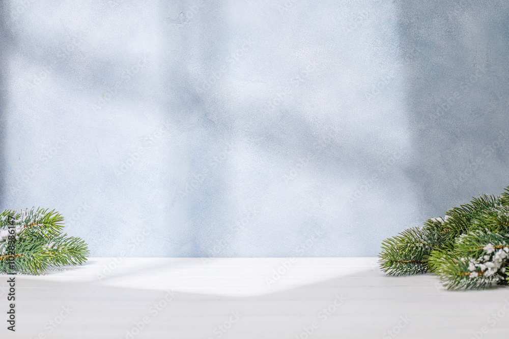 Aufkleber christmas template featuring snowy fir tree branches on a table with shadows and sun glares softly f