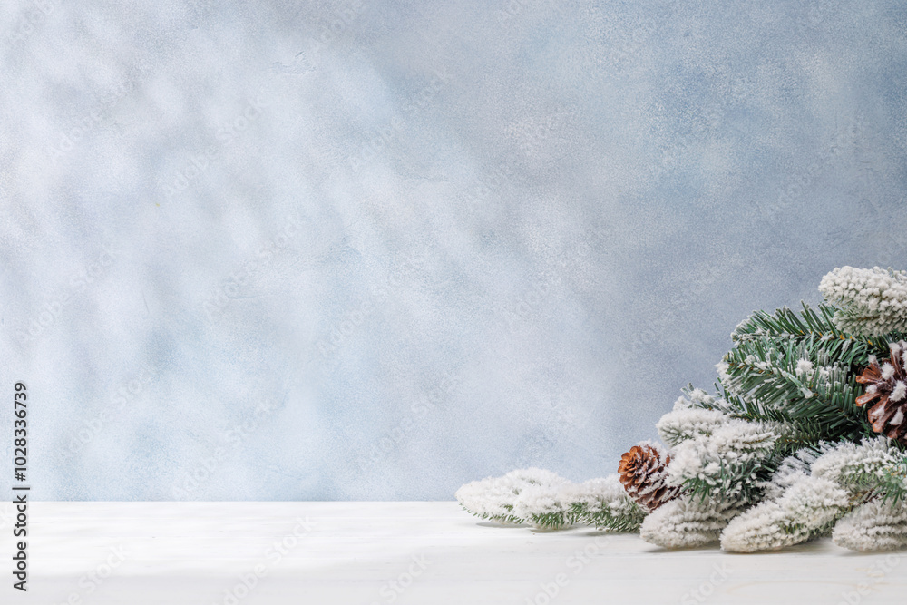 Aufkleber christmas template featuring snowy fir tree branches on a table with shadows and sun glares softly f