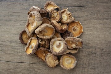 Dried mushrooms , Deied shiitake mushrooms on wooden background