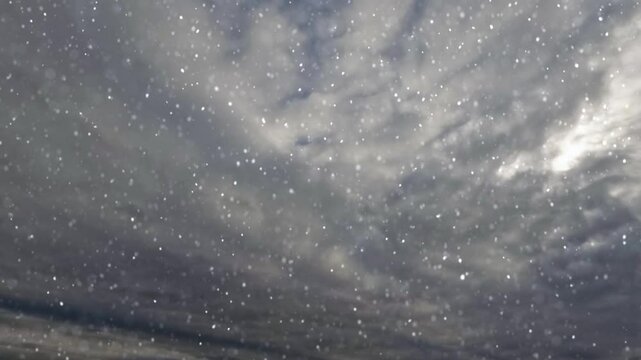 timelapse with snow fall on massive dark clouds bg