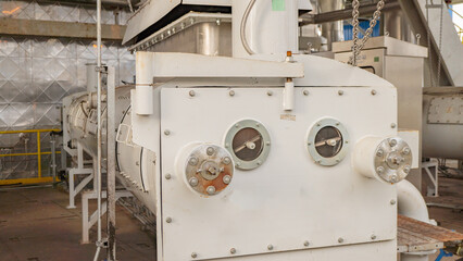Industrial Machinery coal feeder power plant. A close-up view of an industrial machine in a factory setting.