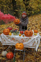 Halloween pumpkin and family party. Celebration of Halloween: cute child, fashion kid, beautiful...