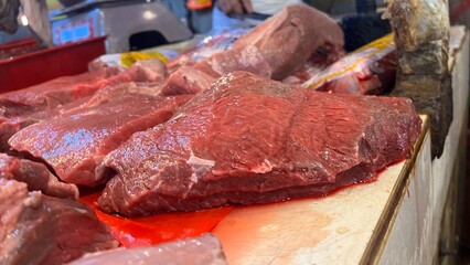 Fresh meat for sale in the meat market.Fresh Beef Mutton lamb for sale in a butcher shop.Meat on the stall. selling meat, pork, fish in local  traditional market. traditional butcher stall.