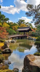 Naklejka premium Traditional Japanese Garden with a Wooden Bridge and a Gazebo Over a Pond.