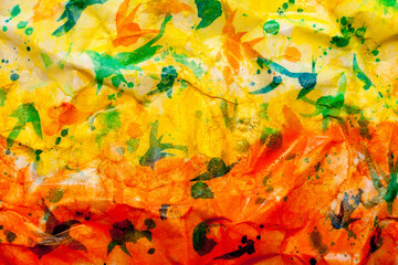 Creative abstract watercolor painting with many colors on crumpled wet paper. Background with blurred shapes for your creative work or design.