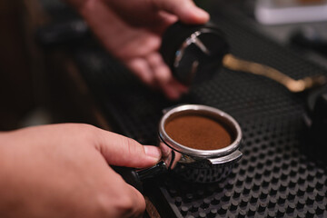 In lively cafes, the barista expertly used the machine as a tool to tamp the espresso beans,...