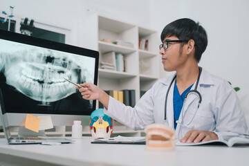 At the clinic, the dentist used an x-ray to examine the patient’s teeth, discussing treatment options and emphasizing the importance of oral health care and effective medicine.