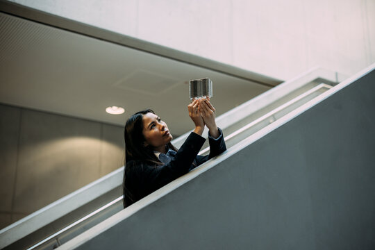 Engineer analyzing heating module at staircase in office