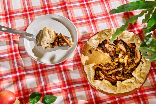 Apple pie over red table cloth