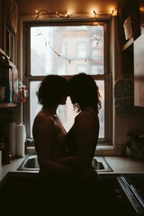 A romantic couple embraced in silhouette in a dimly lit kitchen, accented by string lights, capturing an intimate and affectionate moment in a cozy home setting.