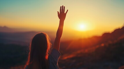 Mental Health concept. Happy girl raised hand on blurred mountain sunrise background