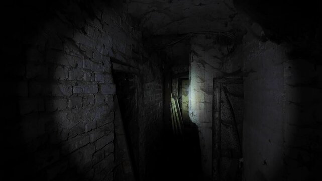 Flashlight in Scary underground, basement. Old abandoned warehouses in a dungeons.
