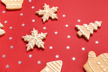 Composition with different Christmas cookies and confetti on color background