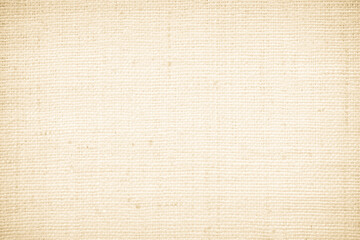 Closeup detail of beige fabric texture background. High resolution photo.