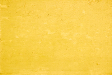 Yellow concrete stone texture for background in summer wallpaper. Cement and sand wall of tone vintage minimal. Concrete abstract wall of light orange color, cement texture white blank for home decor.