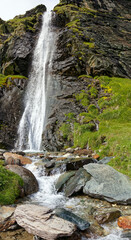 Vertical mountain panorama, waterfall in the Alps, Lombardy, Italy, Europe