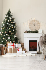Interior of living room with Christmas decor and fireplace