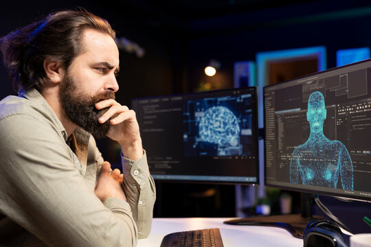 Artificial intelligence entity with anthropomorphic body escaping control of creator, appearing on screen, confusing programmer. Frowning man looking bemused at AI robot gaining humanoid form