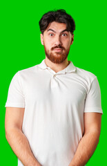 Obraz premium A man with a serious expression stands against a vibrant green background