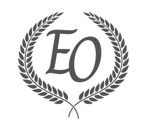 Initial letter E and O, EO monogram logo design with laurel wreath. Luxury calligraphy font.