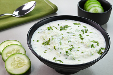 Cucumber raita served in a bowl.