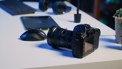 Professional camera equipment on desk in empty creative photography studio, close up. Video...