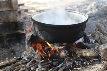cooking pot on wood fire
