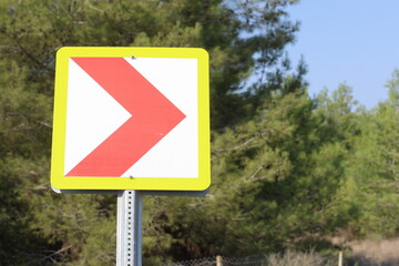 red chevron signs indicating dangerous curve