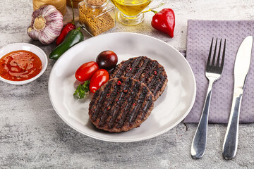 Grilled burger cutlet with sauce