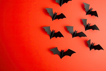 Naklejka premium halloween and decoration concept - paper bats flying with generative ai