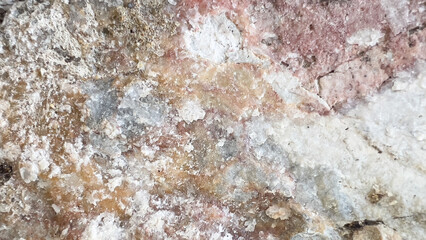 Colorful stone texture, hard, rough and cracked surface, stone background, abstract background.